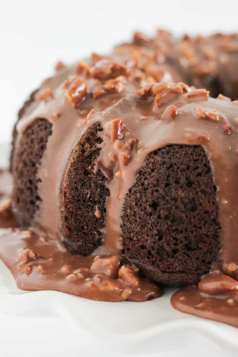 An close up photo of a chocolate cake with chocolate pecan frosting.