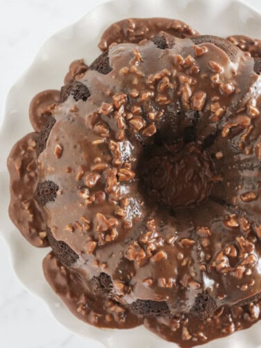 A finished Texas Sheet Cake Bundt Cake with chocolate pecan frosting.