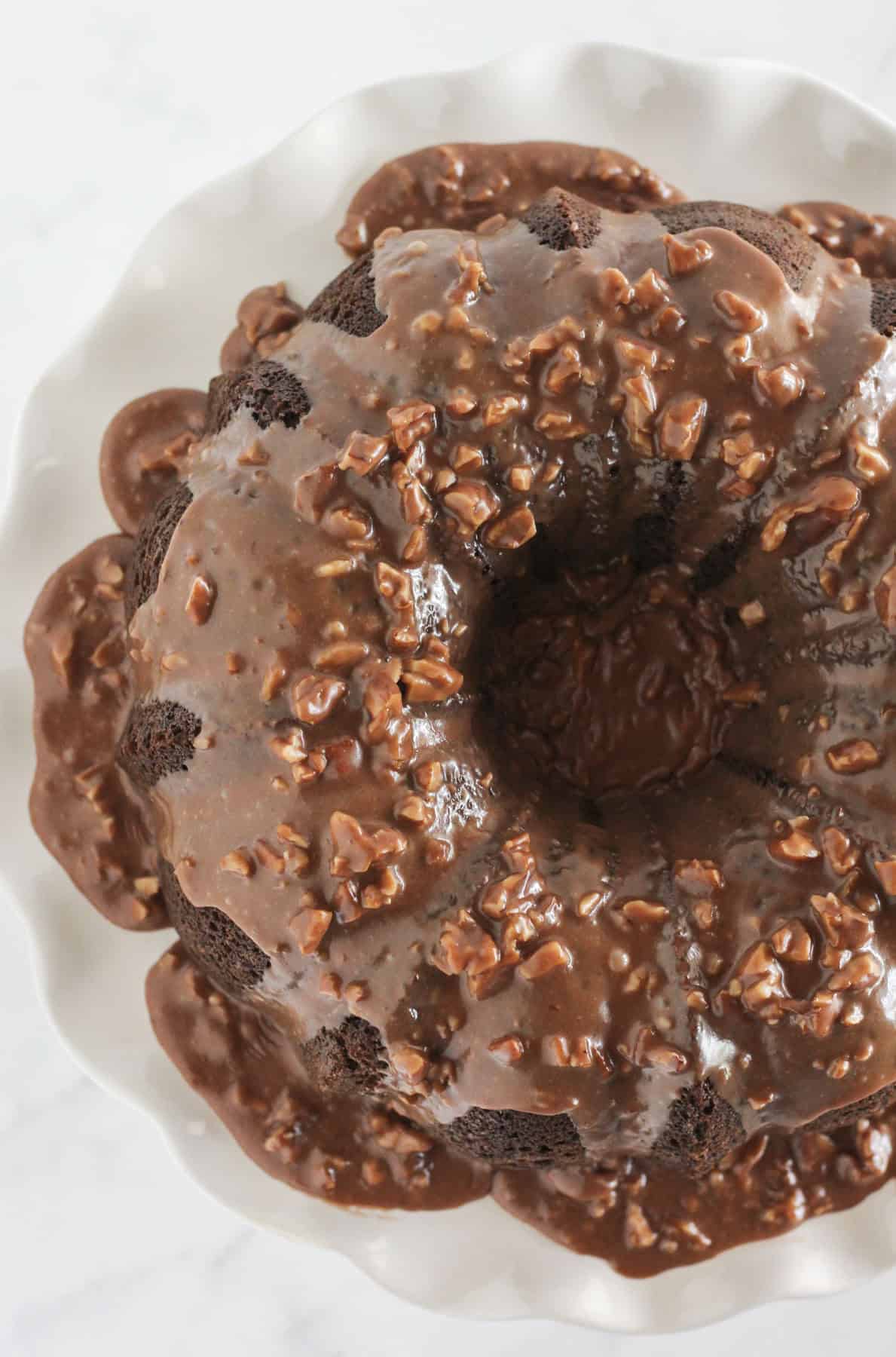 A finished Texas Sheet Cake Bundt Cake with chocolate pecan frosting.