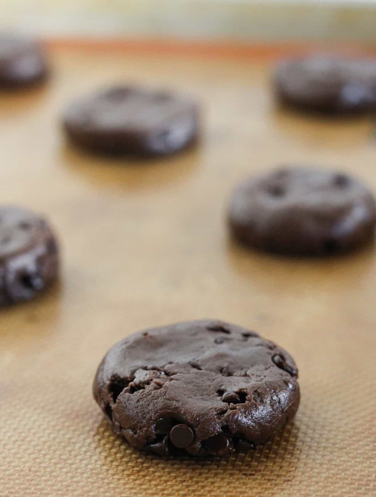 Chocolate espresso cookie dough on a baking sheet.