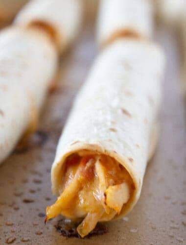 Easy 5 Ingredient Chicken Taquitos recipe featured by top US food blogger, Practically Homemade