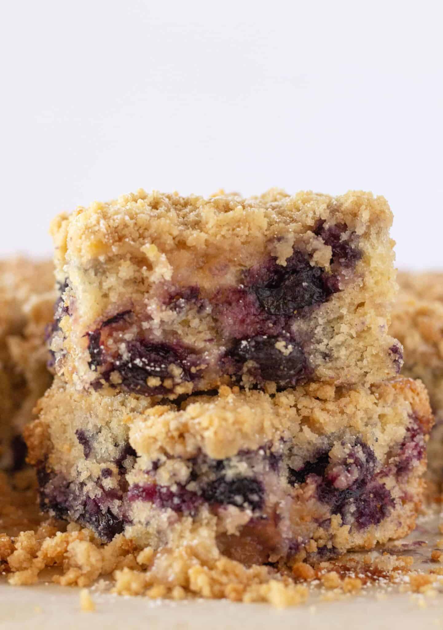 Easy Lemon Blueberry Crumb Cake squares stacked on each other.