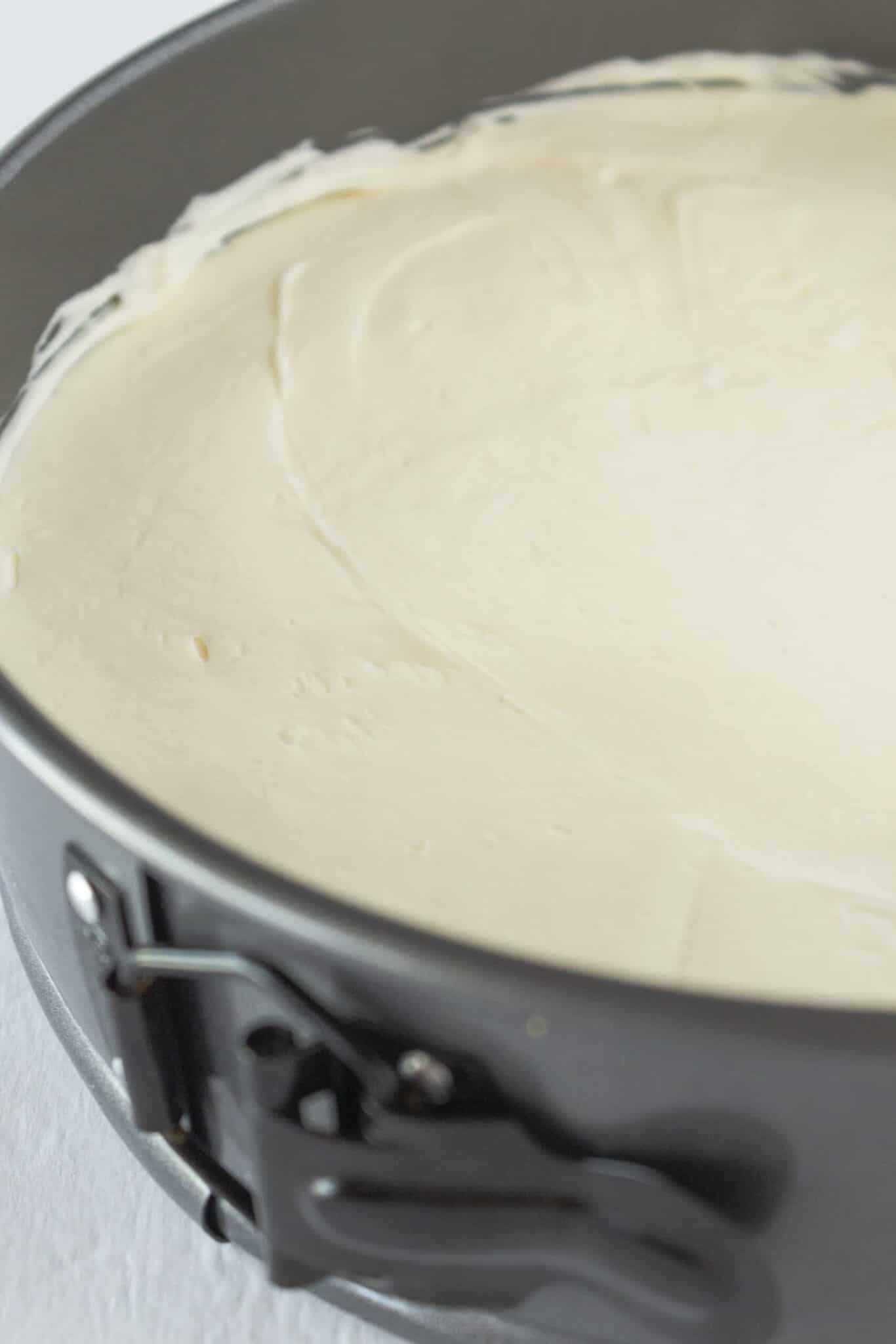 Making the no bake cheesecake filling and adding it to the top of the crust.