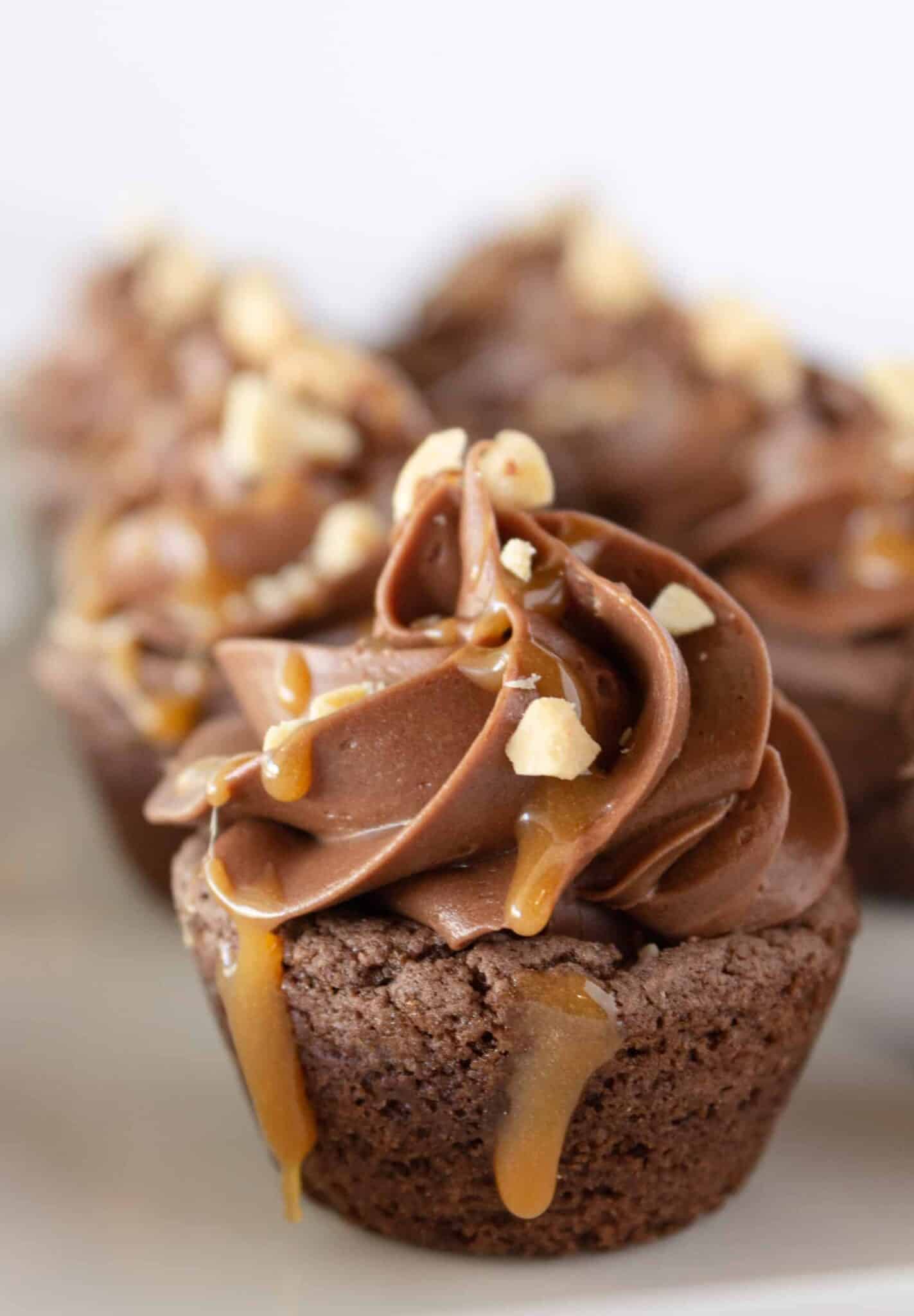 Snickers cookie cups with caramel sauce.