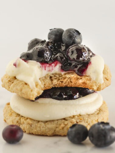 Blueberry cheesecake cookies stacked on each other.