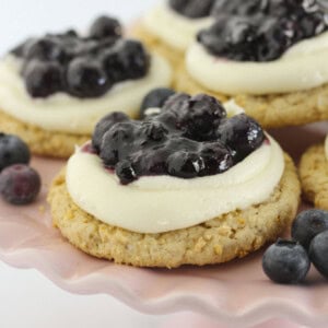 Blueberry Cheesecake Cookies on a pink cake plate.