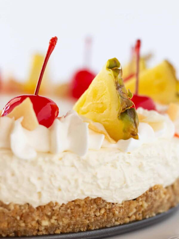 Easy Cheesecakes: Festive Pina Colada Cheesecake Recipe featured by top US dessert blogger, Practically Homemade