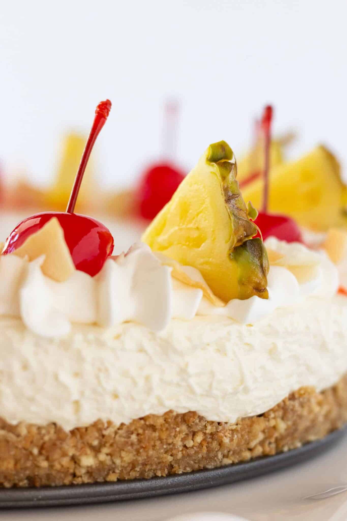 Easy Cheesecakes: Festive Pina Colada Cheesecake Recipe featured by top US dessert blogger, Practically Homemade