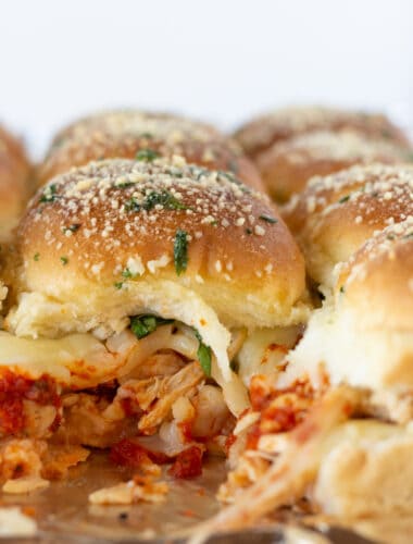 Easy Shredded Chicken Parmesan Sliders featured by top US food blogger, Practically Homemade