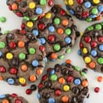 Eight chocolate cake mix M&M cookies on a plate being served.