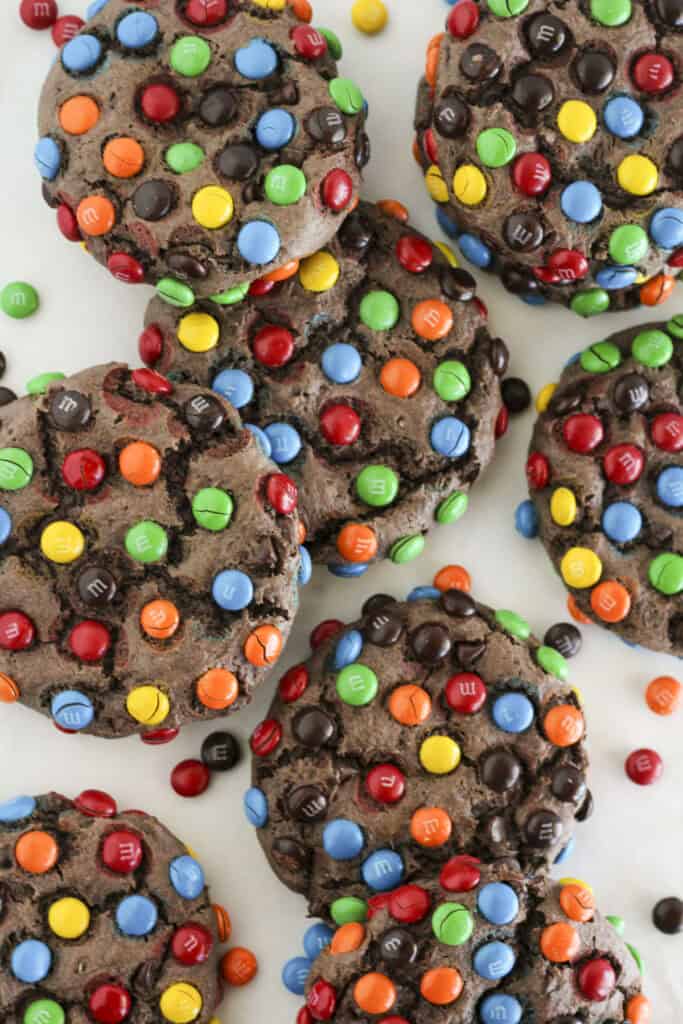 Eight chocolate cake mix M&M cookies on a plate being served.