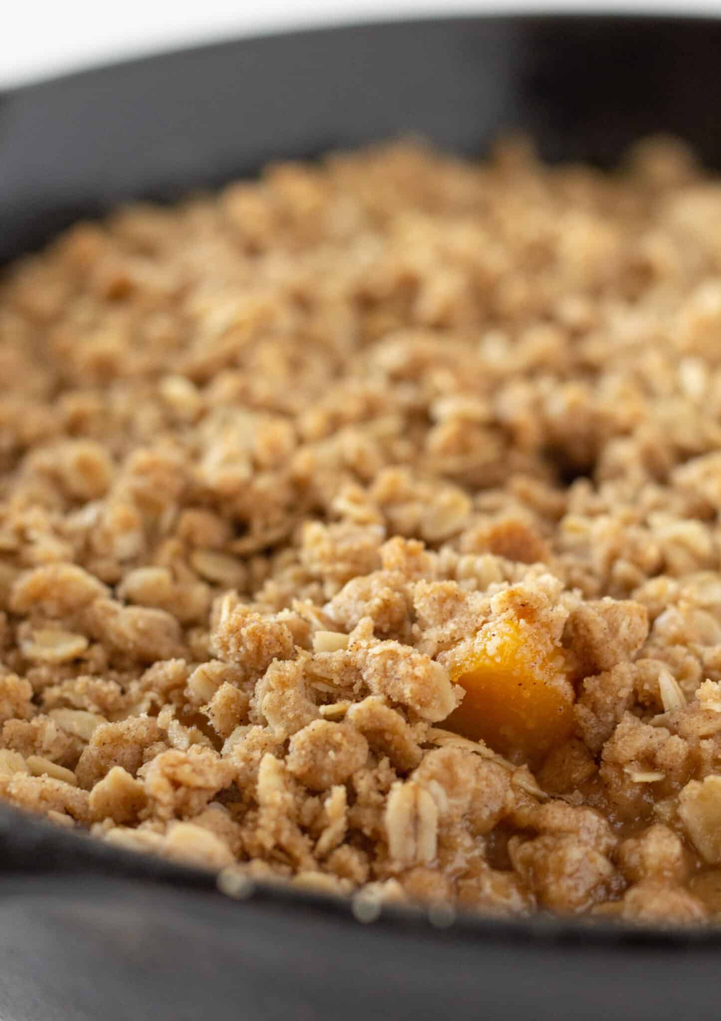 Easy Peach Crisp Recipe with Canned Peaches featured by top US dessert blogger, Practically Homemade