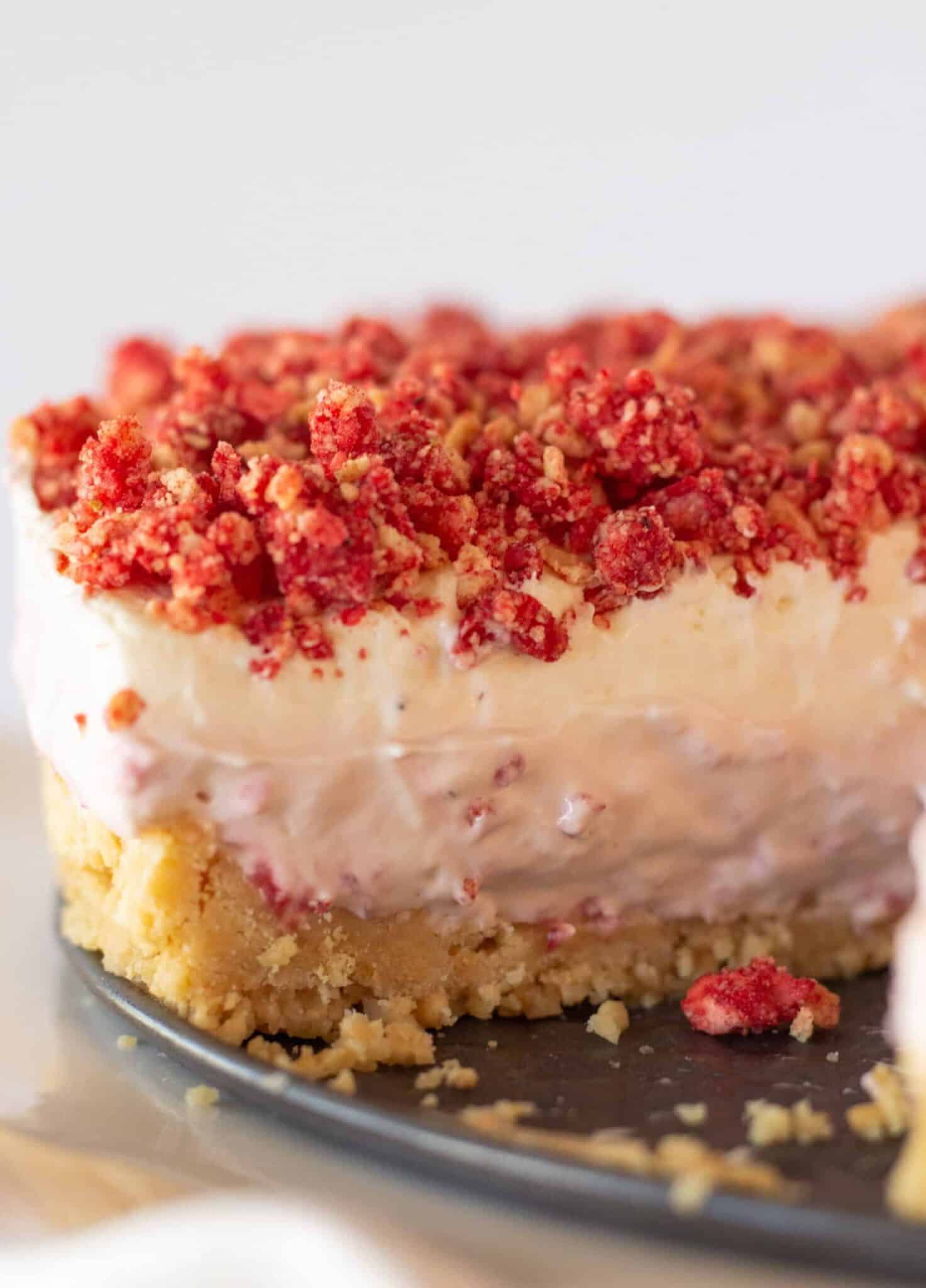 Strawberry Crunch Cheesecake recipe with a Golden Oreo Crust featured by top US dessert blogger, Practically Homemade