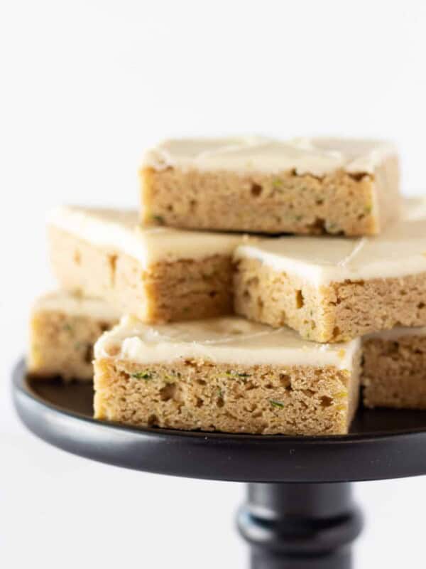 Zucchini Bars Recipe with Cream Cheese Frosting featured by top US dessert blogger, Practically Homemade