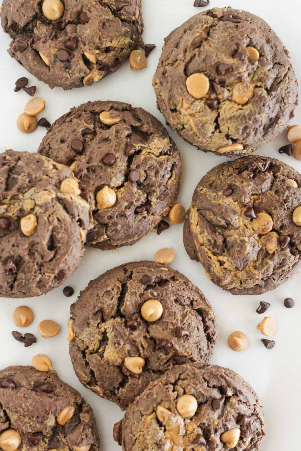 Baked chocolate peanut butter chip cookies on a plate.