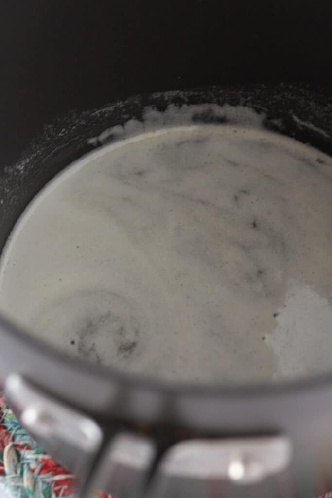 Melted butter in a black saucepan.