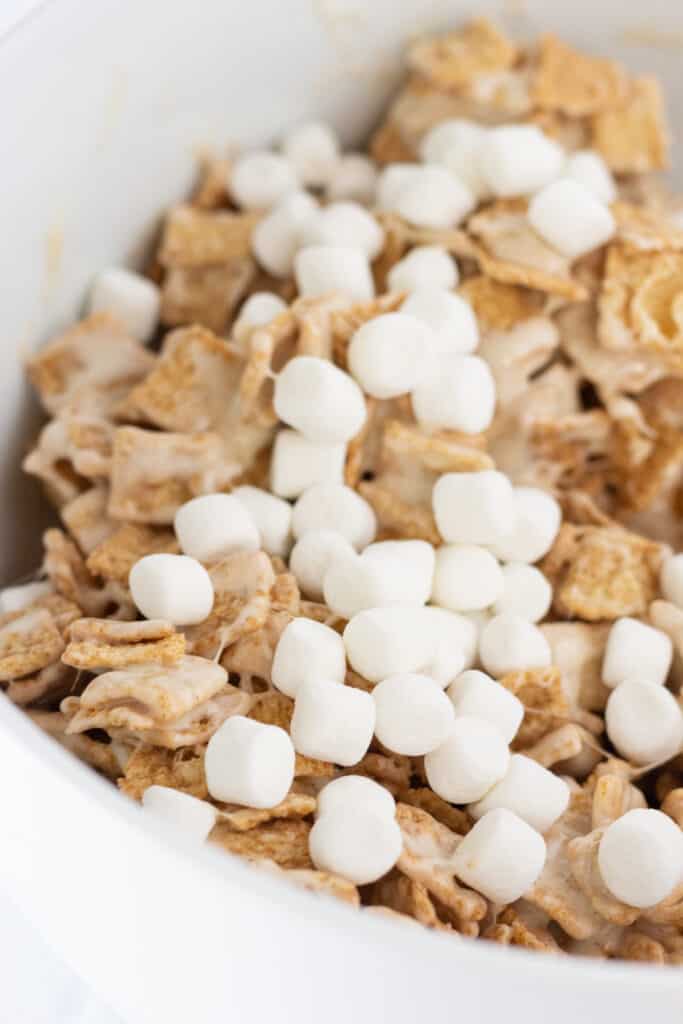 Mini marshmallows on top of the cinnamon toast crunch mixture.