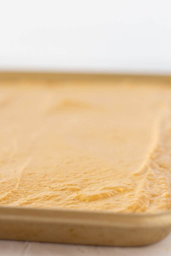Pumpkin pancake batter on a sheetpan.