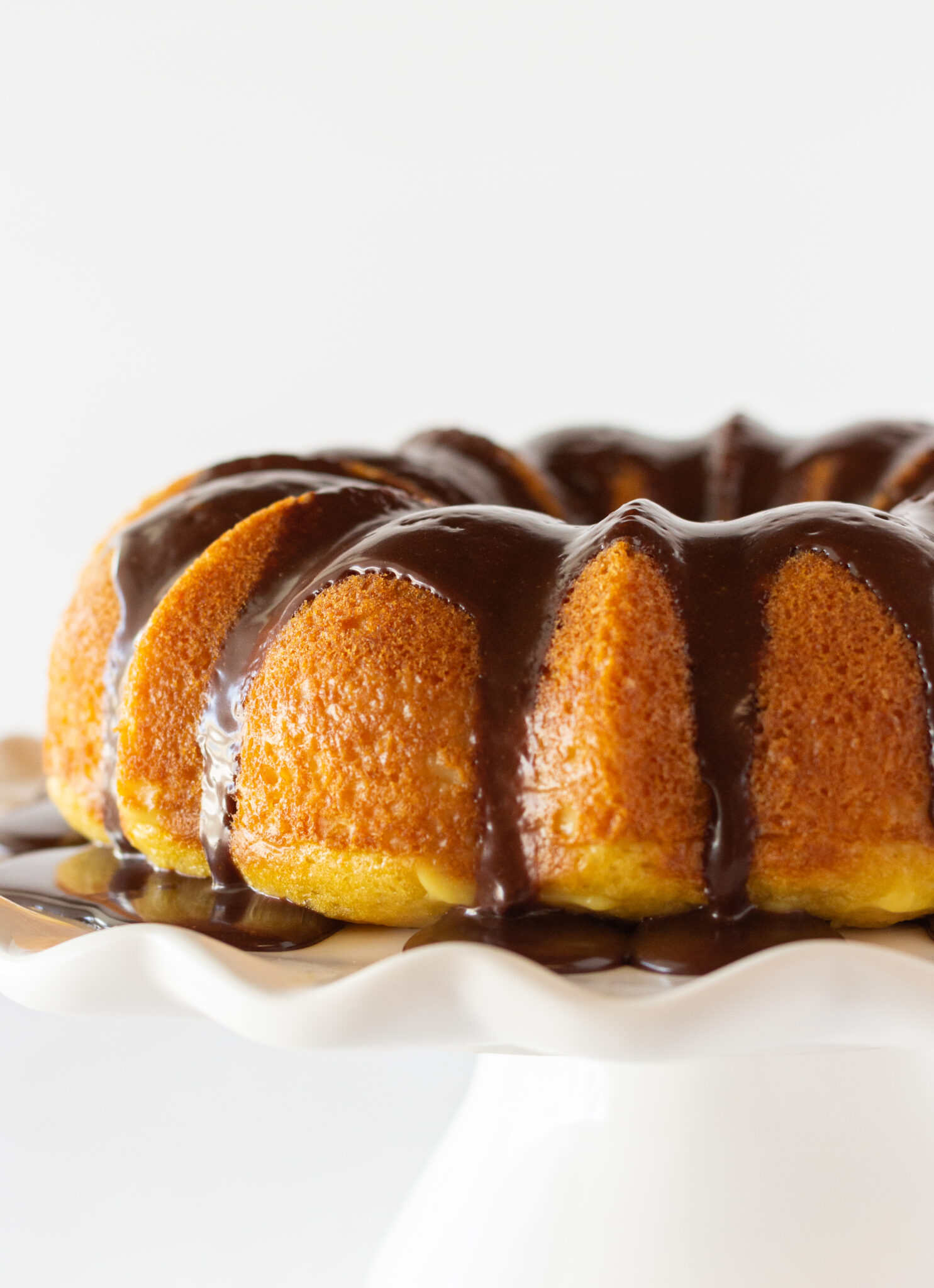 Boston cream pie poke cake recipe featured by top US desserts blogger, Practically Homemade