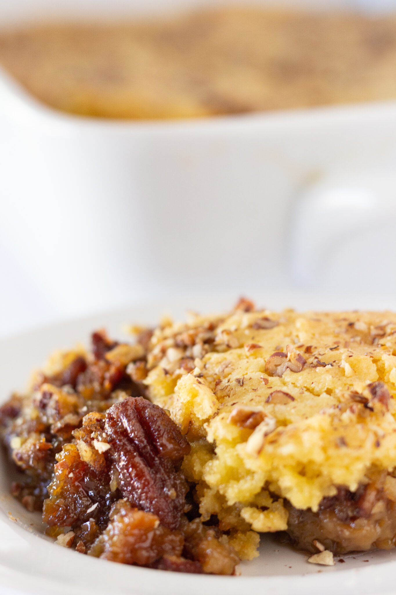 Easy Pecan Pie Cobbler Recipe with a Cake Mix, a fall dessert featured by top US dessert blogger, Practically Homemade.