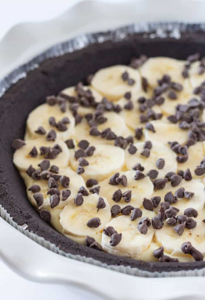 A chocolate cookie crust filled with the banana pudding mixture and topped with sliced bananas and chocolate chips.