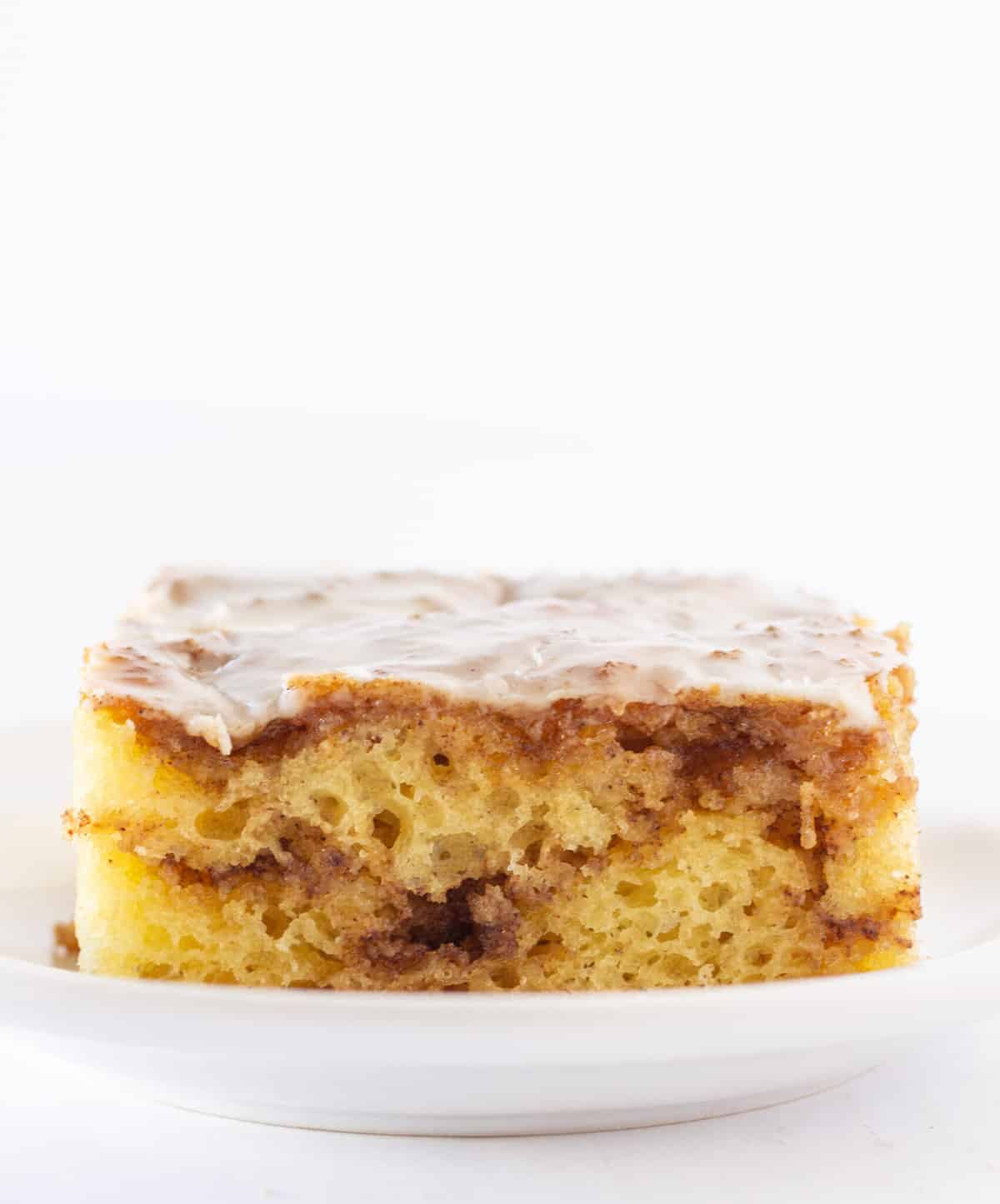 Easy Cinnamon Roll Cake Recipe Made with a Cake Mix by top US food blogger, Practically Homemade