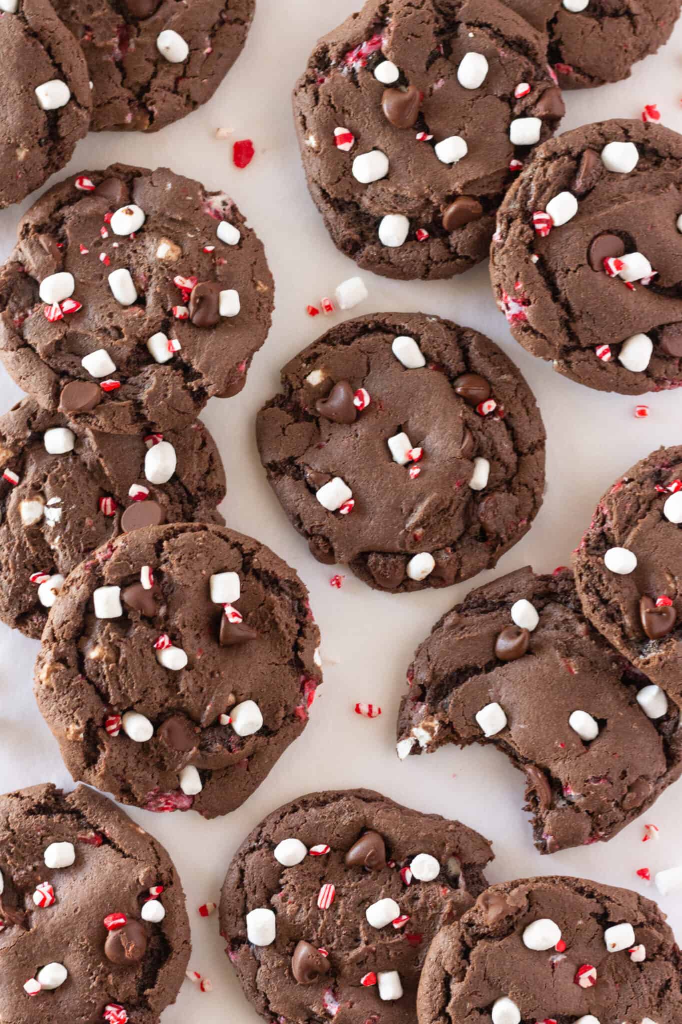 Looking down at Peppermint Hot Cocoa Cookies that have mini marshmallows and chunks of peppermint on top.