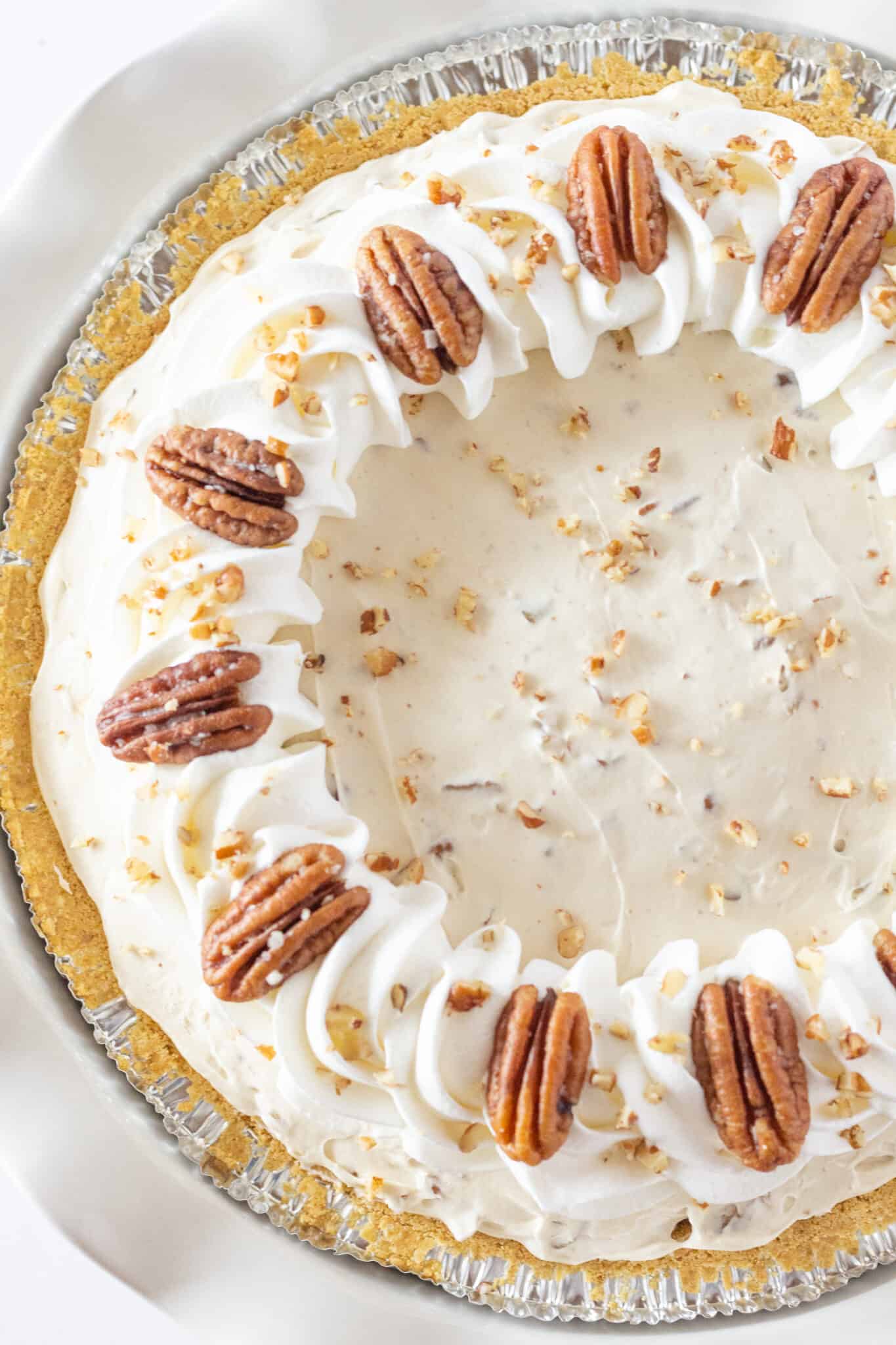 Easy Butter Pecan Cream Pie Recipe with Cream Cheese perfect for Thanksgiving, featured by top US dessert blogger, Practically Homemade