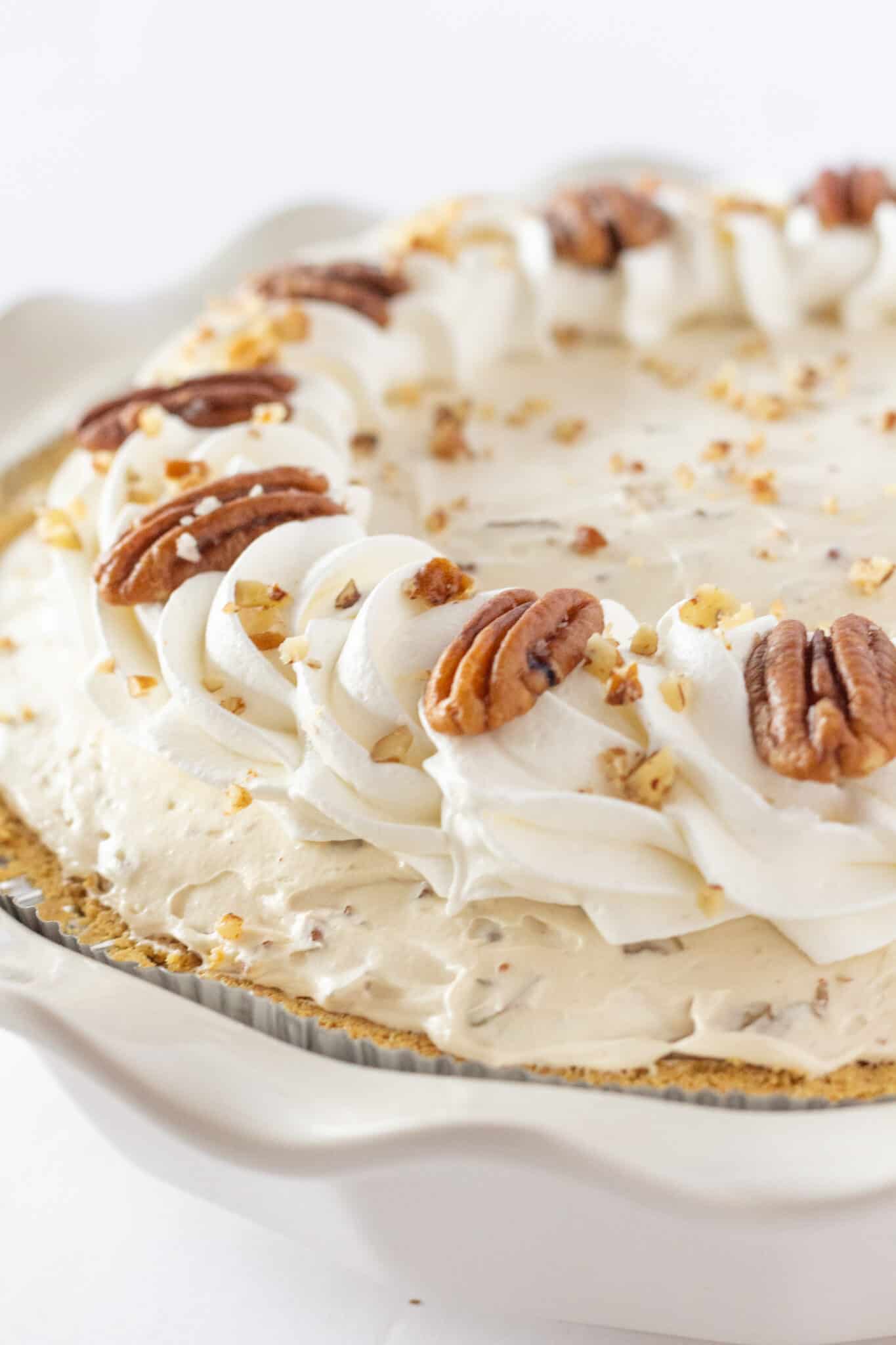 Easy Butter Pecan Cream Pie Recipe with Cream Cheese perfect for Thanksgiving, featured by top US dessert blogger, Practically Homemade