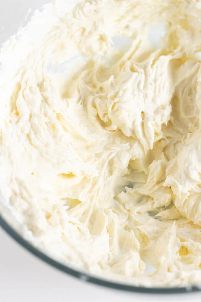 Cream cheese beat until smooth in a glass mixing bowl.