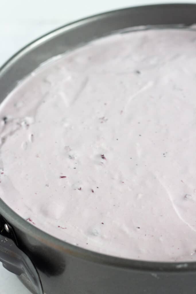 The blueberry layer spread over the other 2 layers of the berry cheesecake.