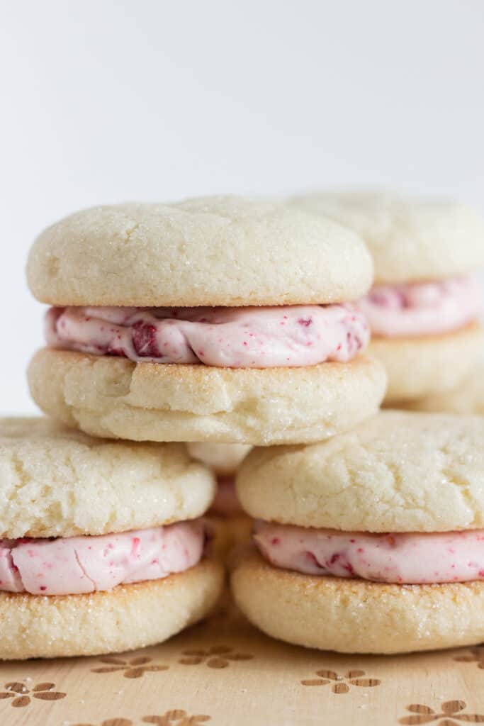 Sugar Cookie Sandwiches with Raspberry Cream Cheese Frosting, by Top US cookie blog Practically Homemade