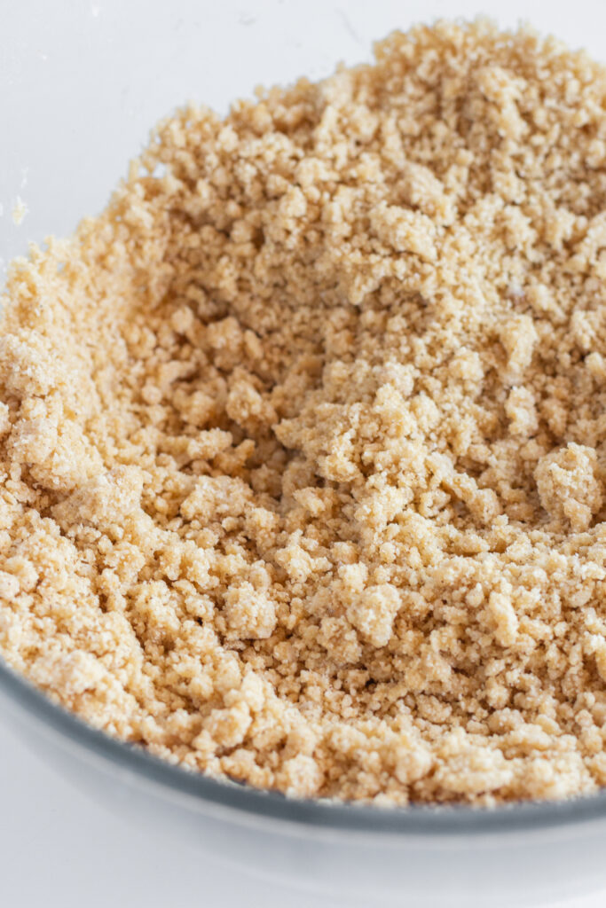 Crumble topping in a glass mixing bowl.