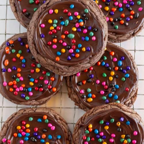 Seven Cosmic Brownie Cookies on a cooling rack.