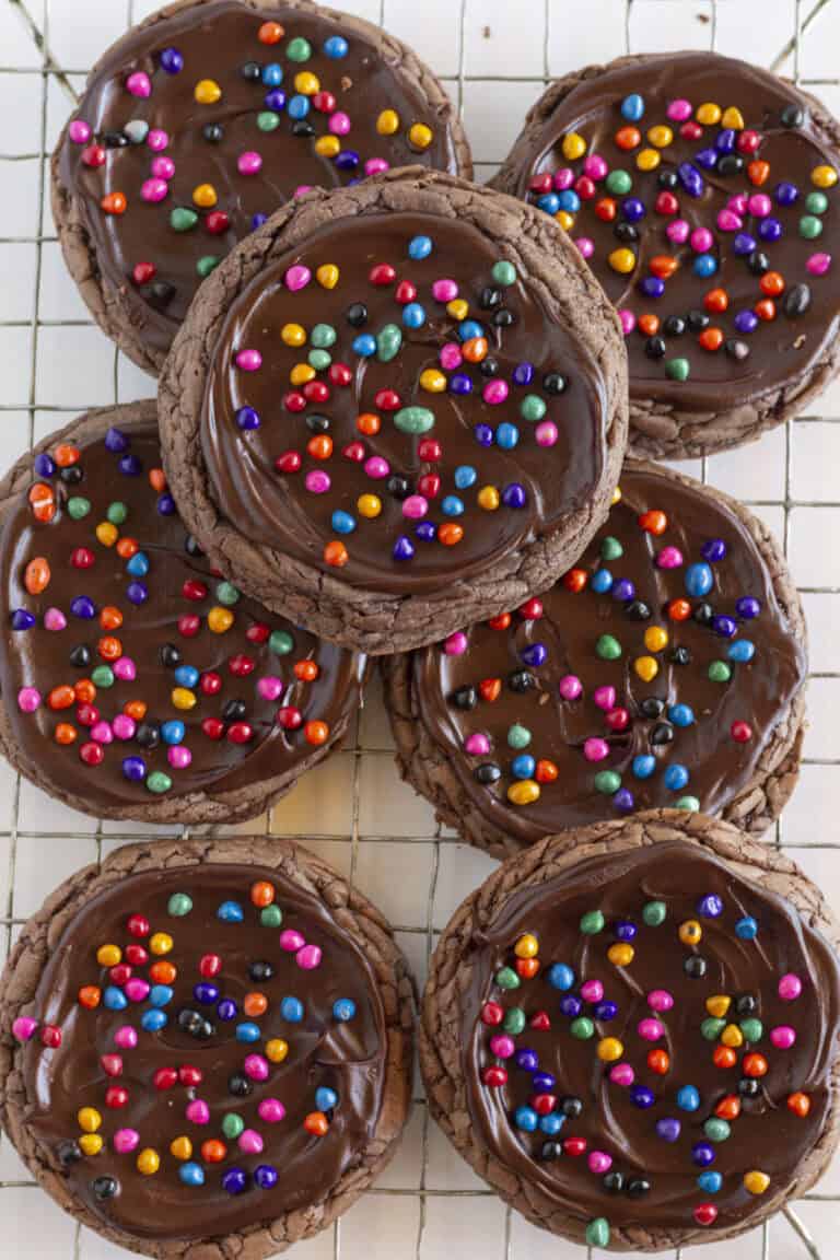 Seven Cosmic Brownie Cookies on a cooling rack.
