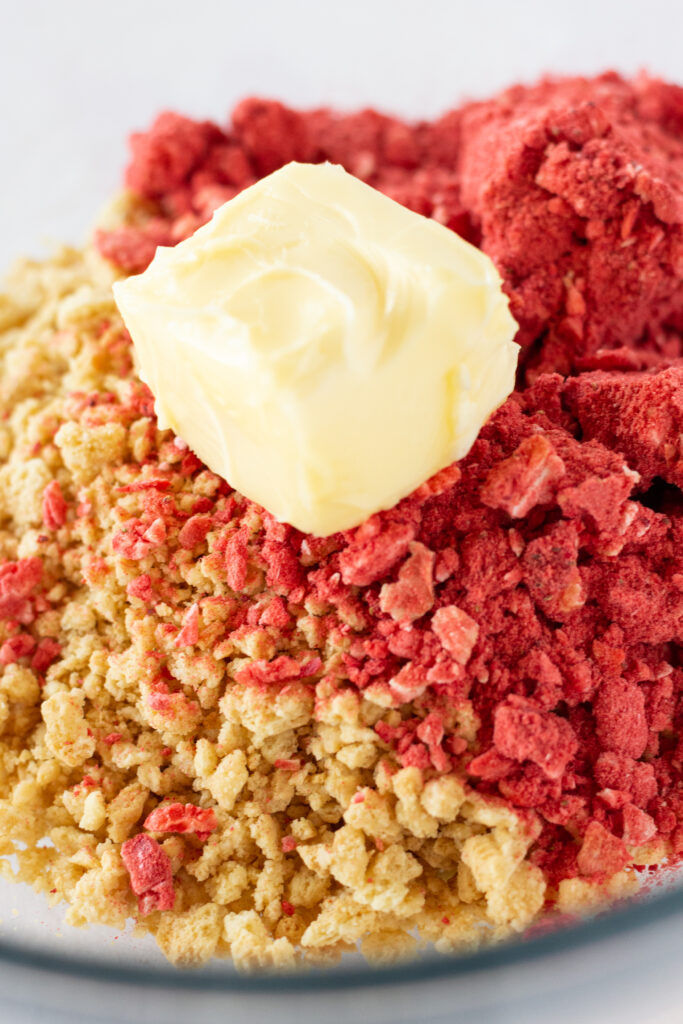 Golden Oreo crumbs, powder made from free-dried strawberries, and butter.