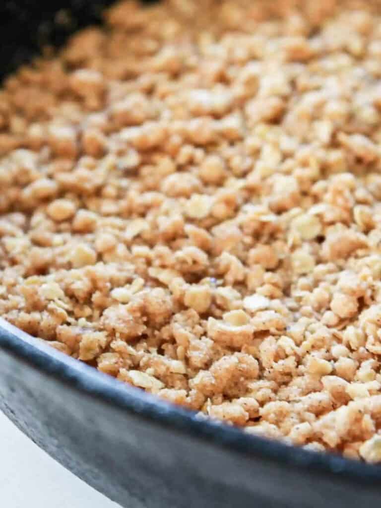 Apple crisp in a cast iron skillet.