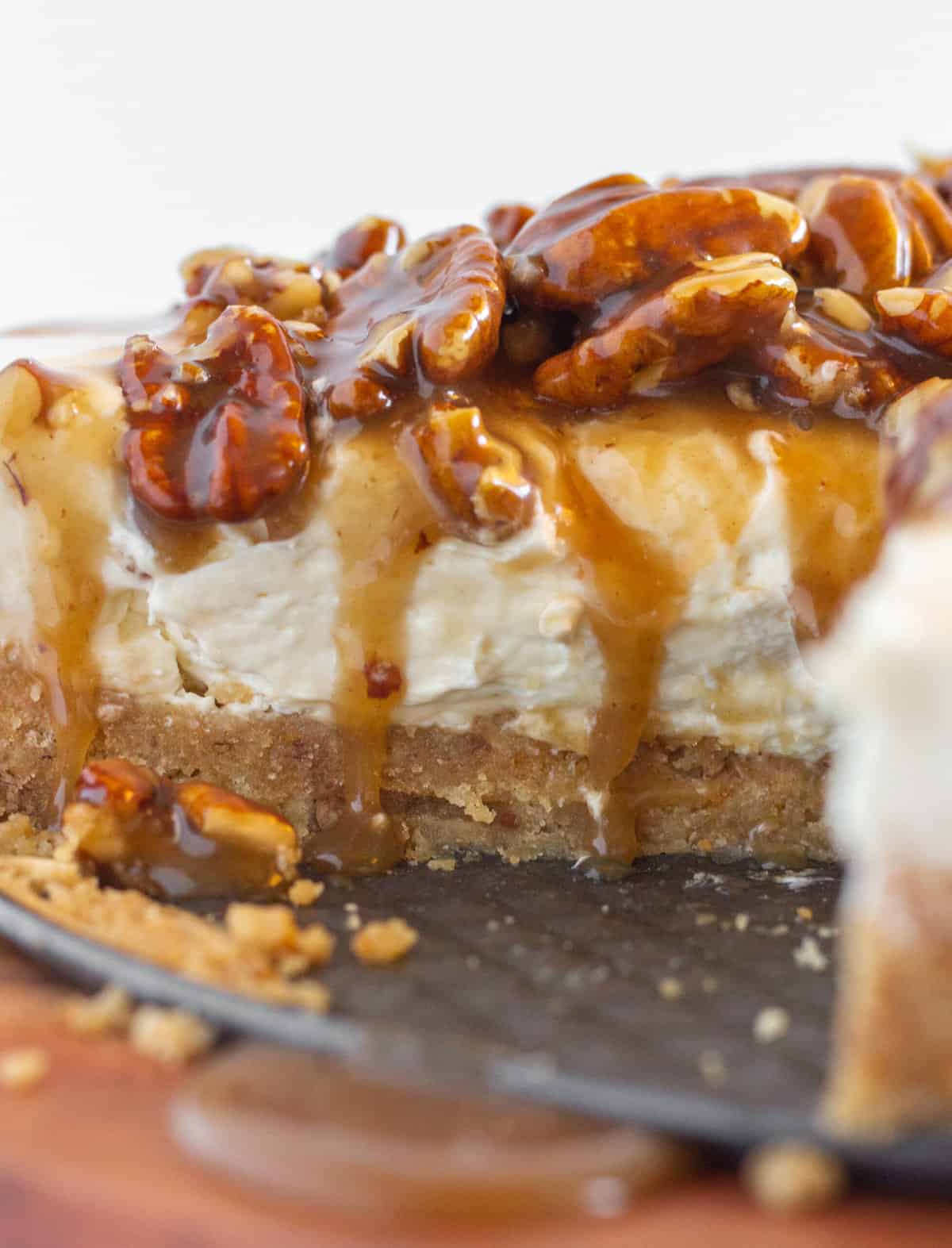 Pecan Pie No Bake Cheesecake with a few slices taken out of it. 