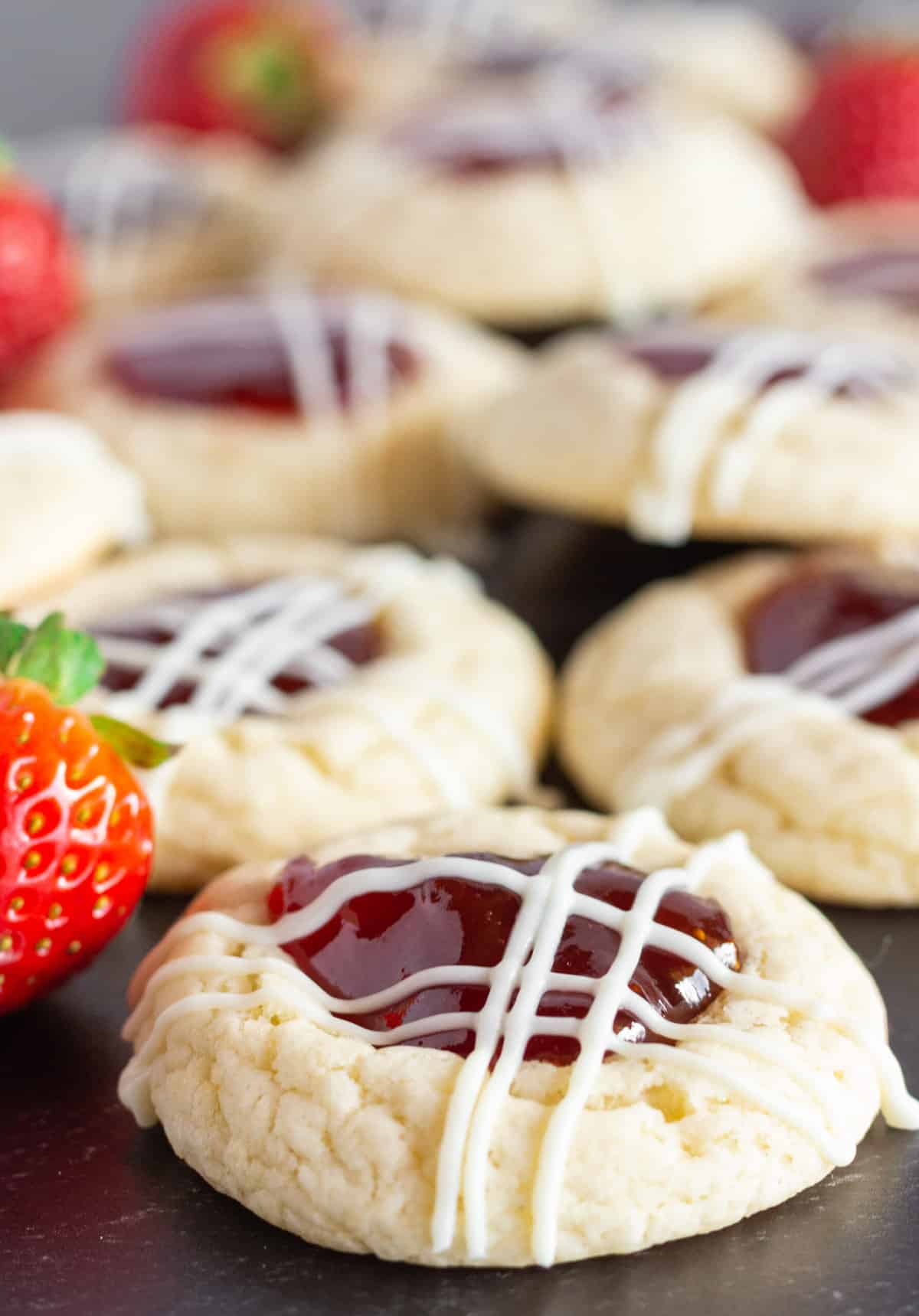 Strawberry Jam Cookies with a drizzle of white chocolate.