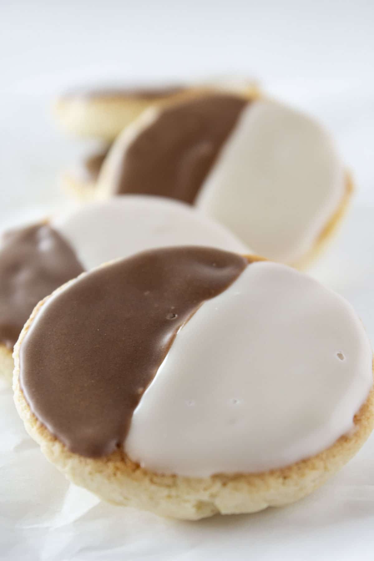 A stack of bakery style half moon cookies.