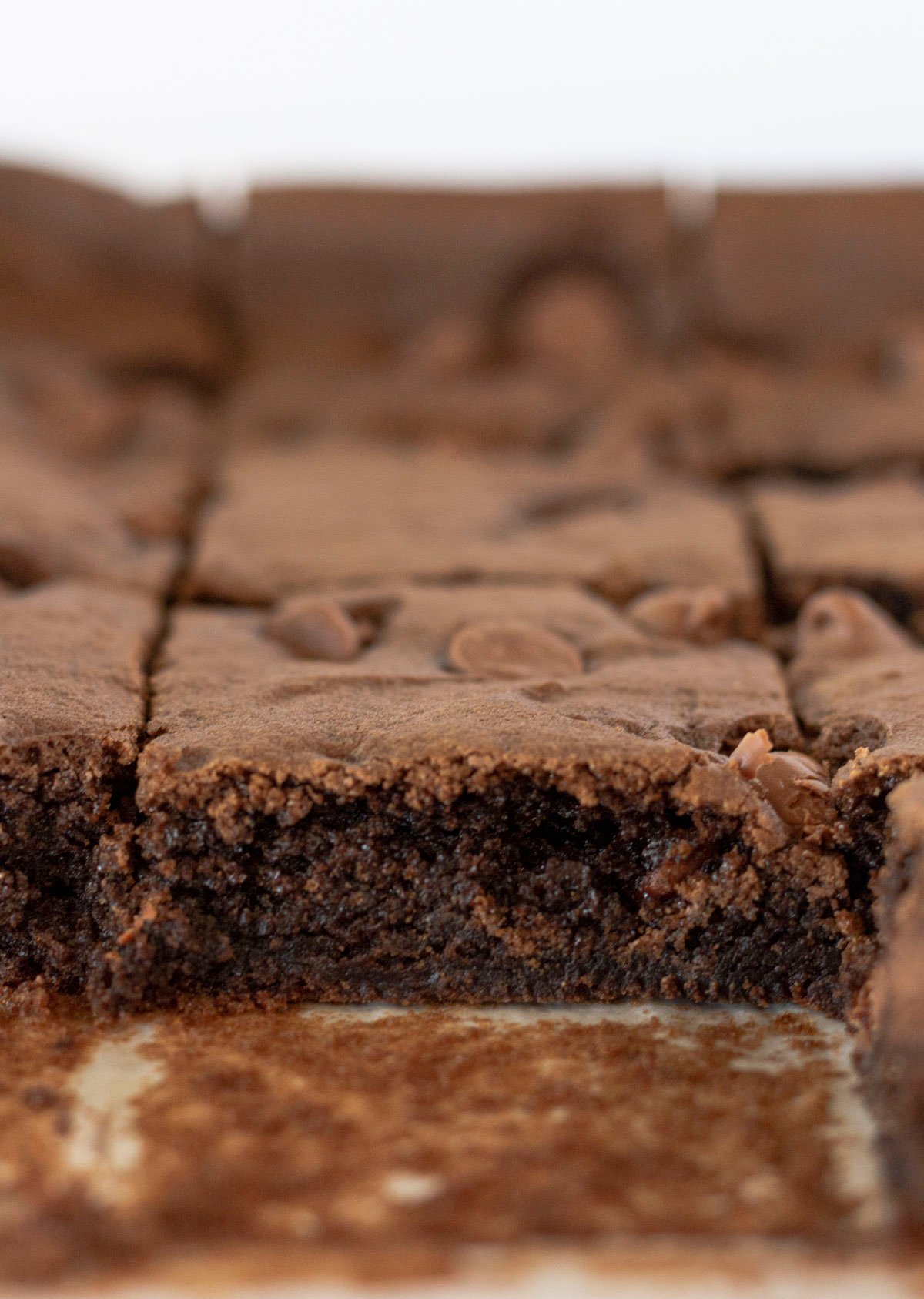 A photo of a cut brownie inside a pan of cake mix brownies.