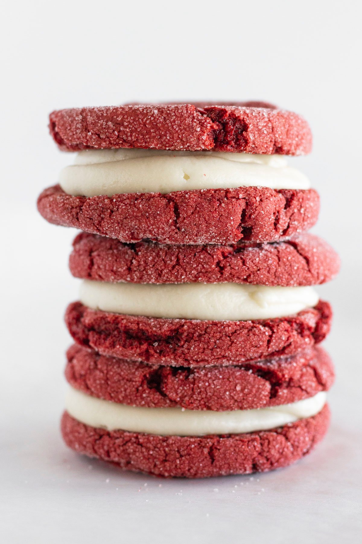 Three Red Velvet Sandwich Cookies stacked on top of each other.