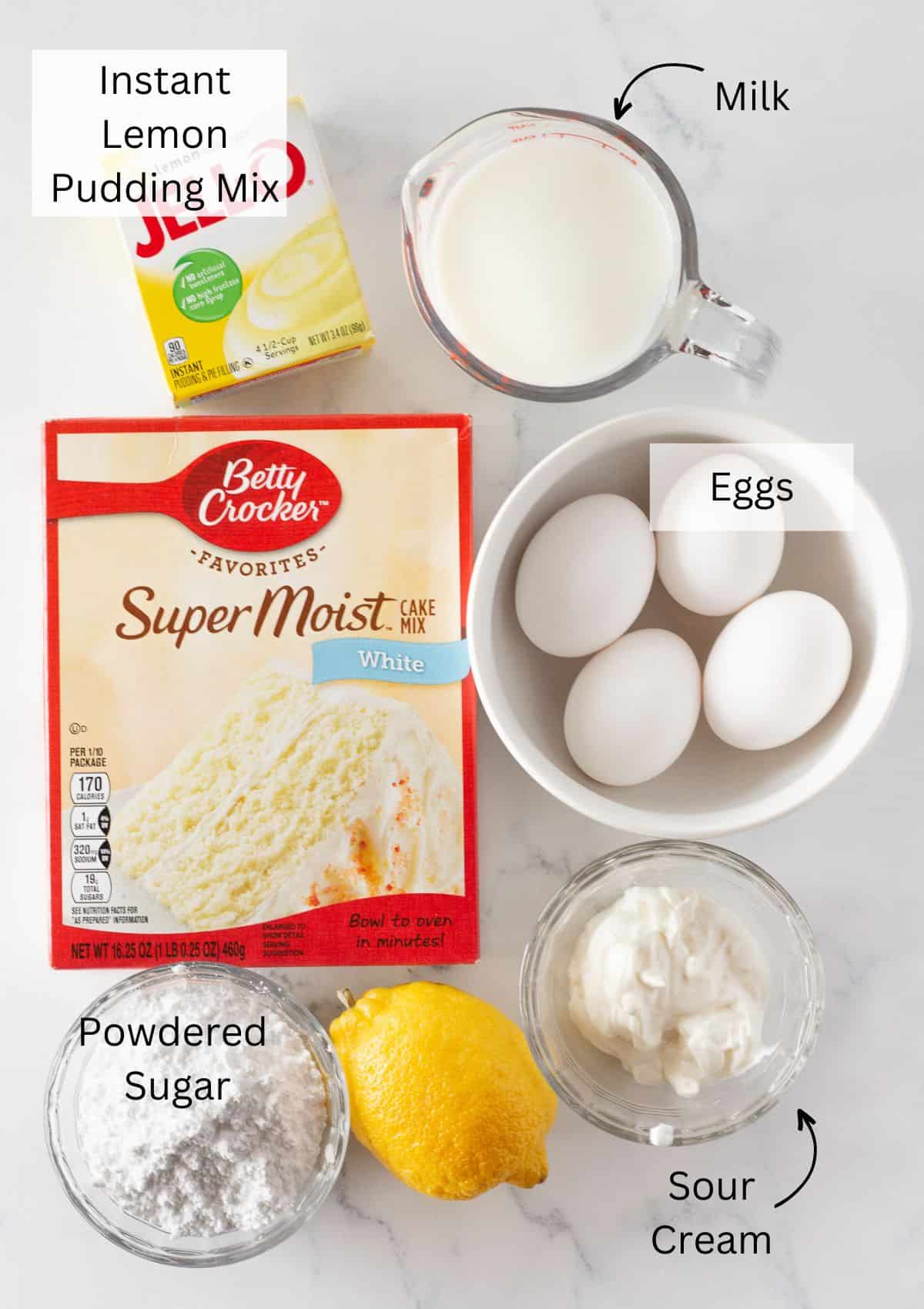 The ingredients needed to make a lemon pound cake in a bundt pan.