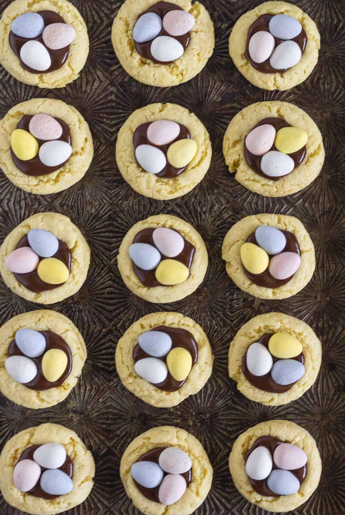 15 Cadbury Mini Egg Cookies on a cookie sheet.