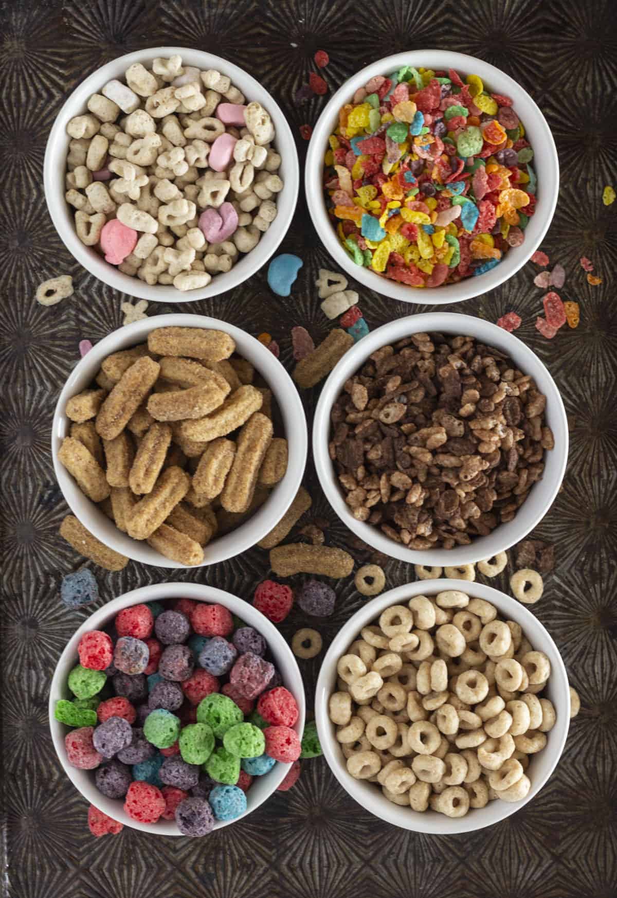 A photo with different kinds of cereal that would work wonderfully in cereal milk frosting.