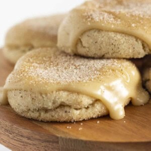 Churro cookies on a wooden cake plate.