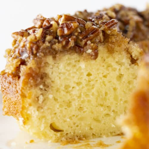 Pecan Upside Down Bundt Cake with a slice taken out.