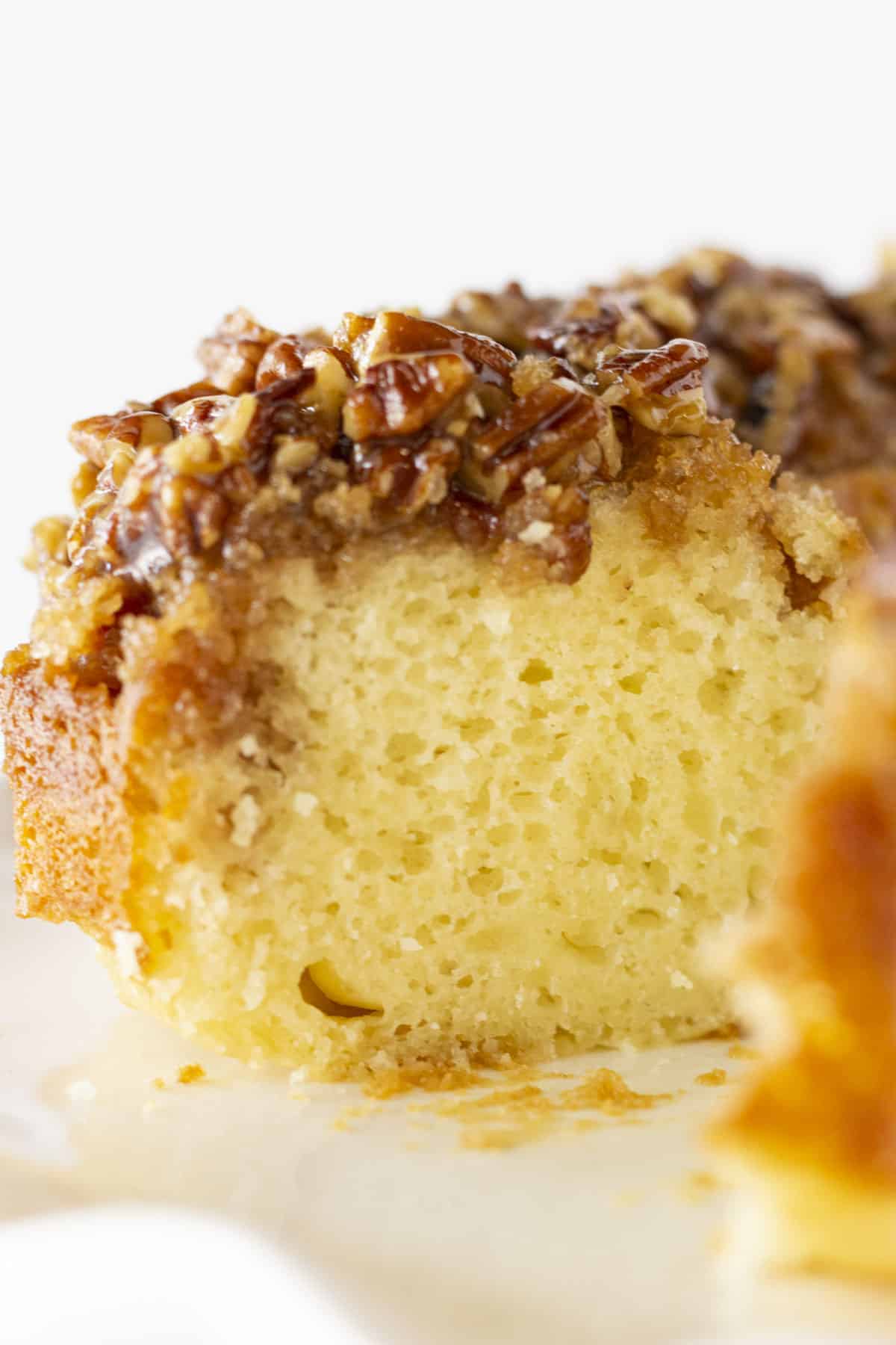 Pecan Upside Down Bundt Cake with a slice taken out.