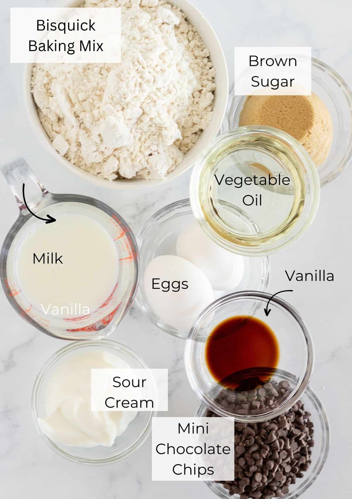 The ingredients needed to make pancake mix muffins with chocolate chips.