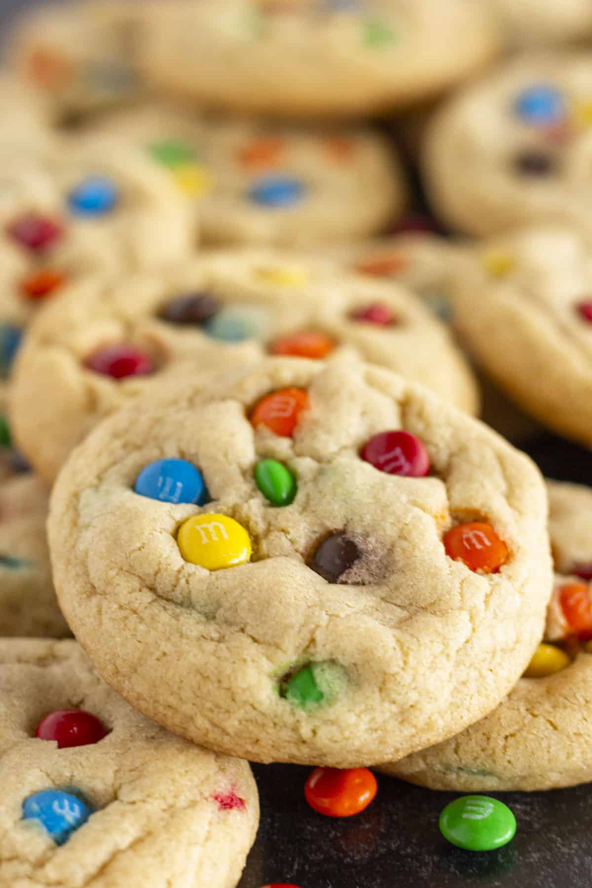 A close up of a chewy Mini M&M Cookie.